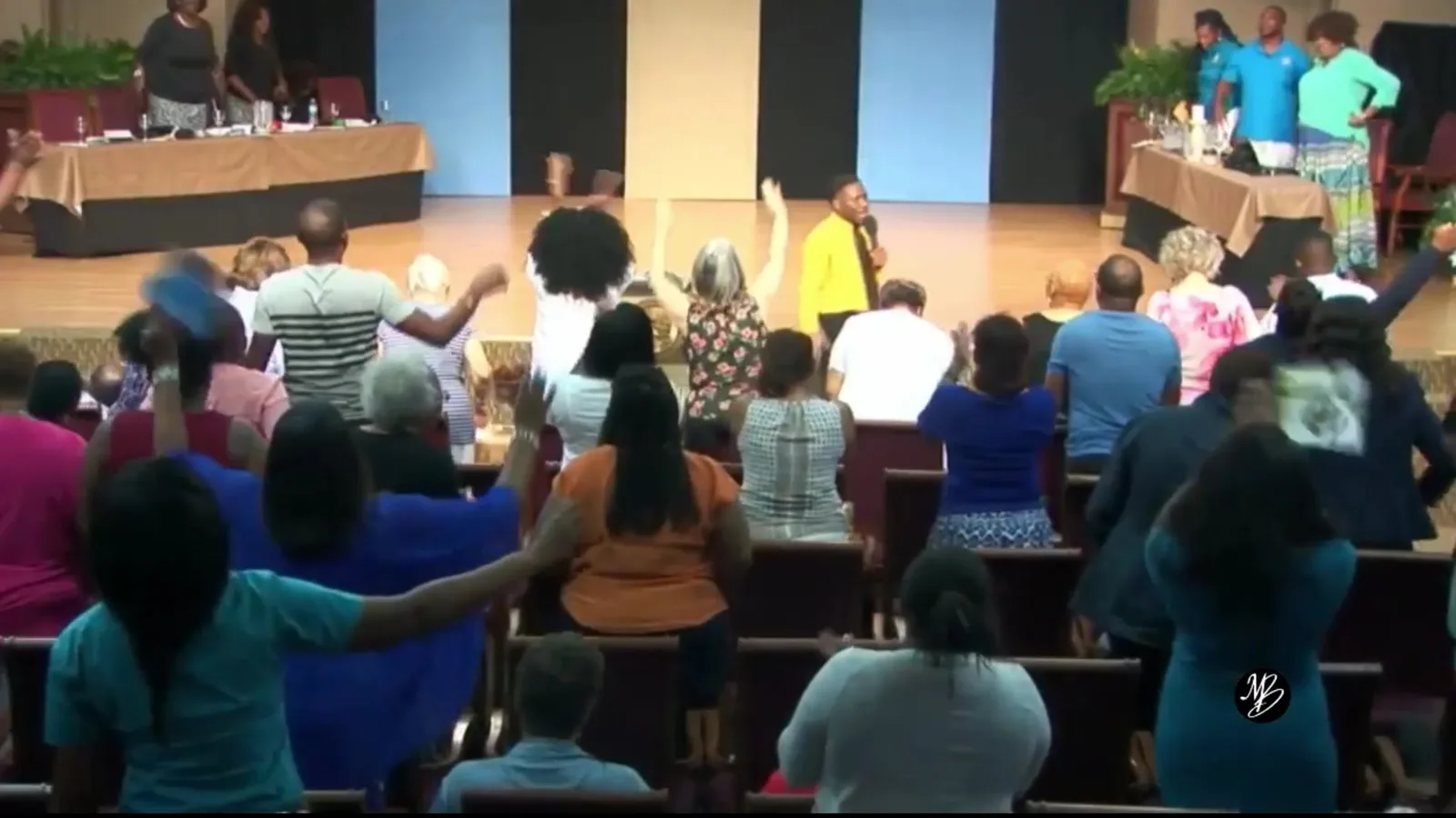 A congregation standing in worship